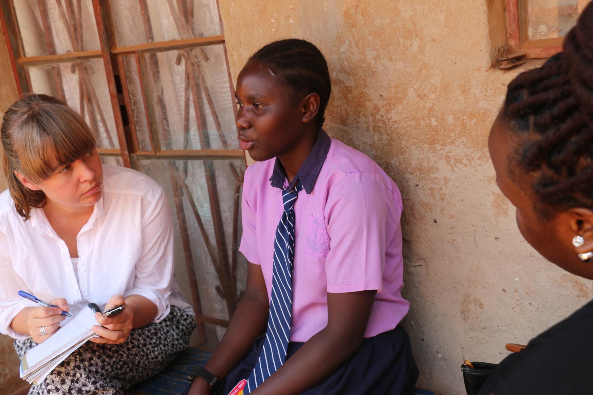 Author Anna Dahlqvist talking with Saudah, a teenager in Kampala, Uganda