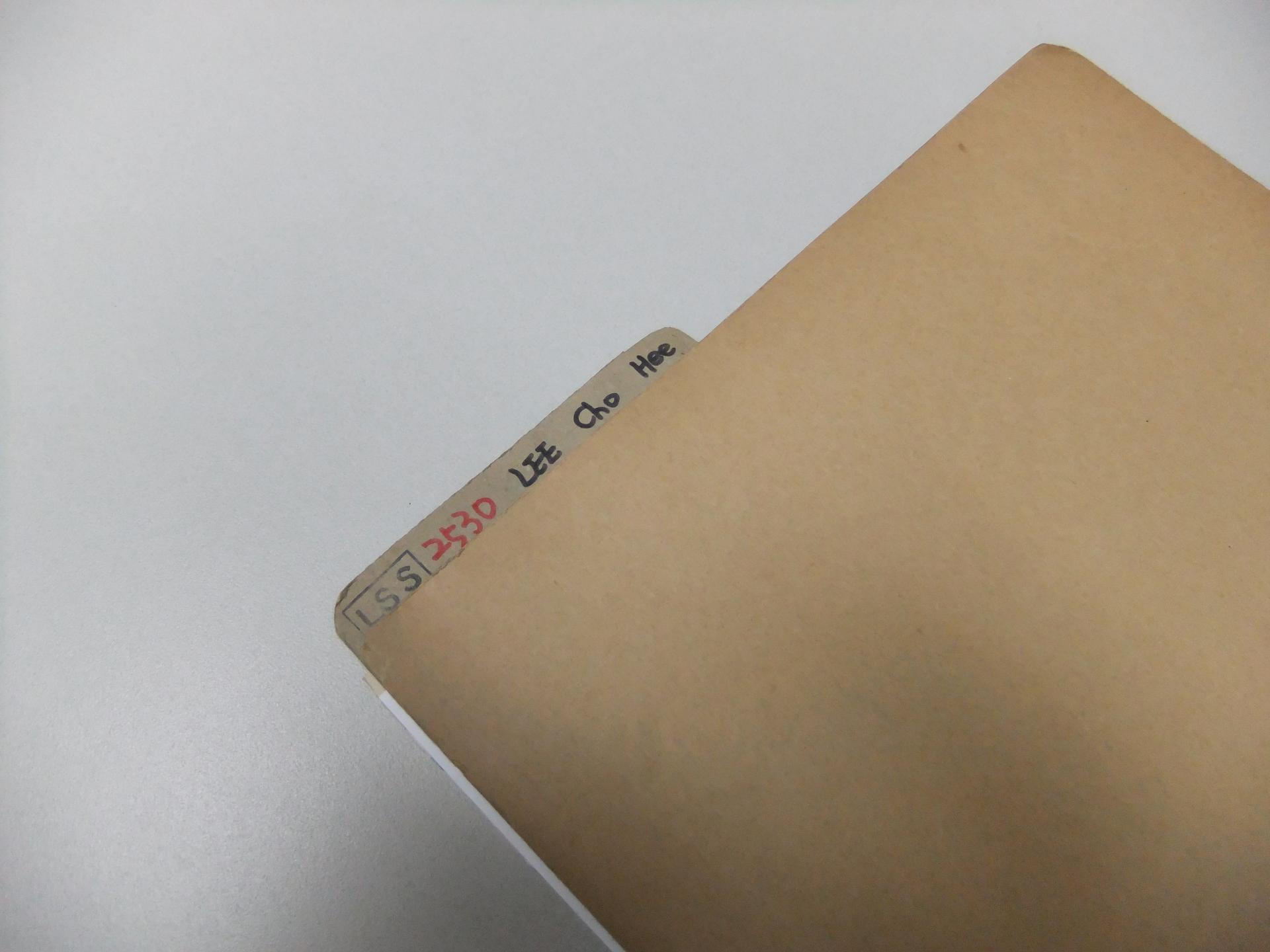 a brown file folder on a desk
