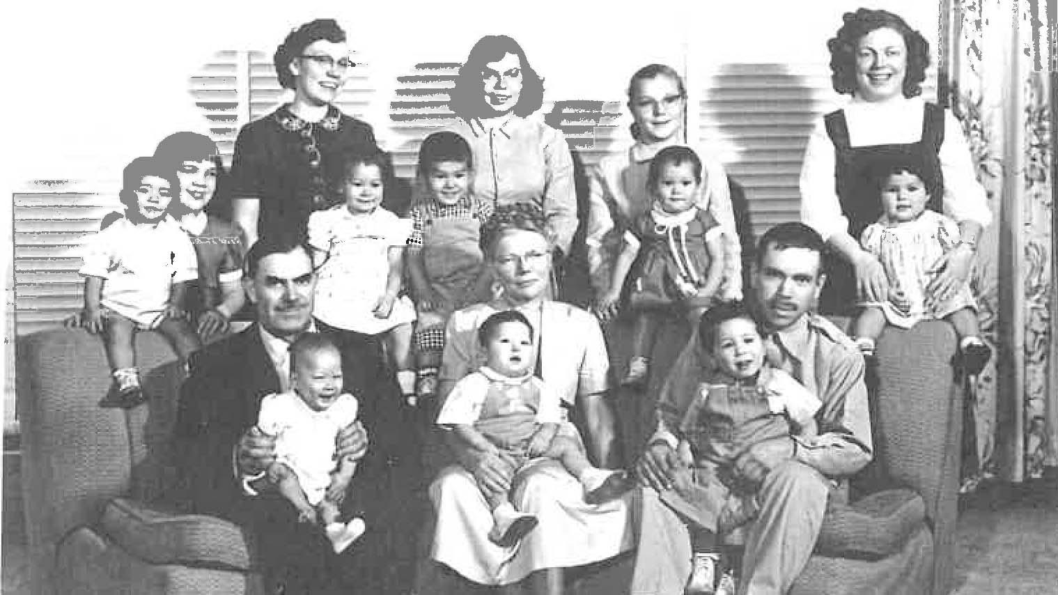A black and white photo of a large family