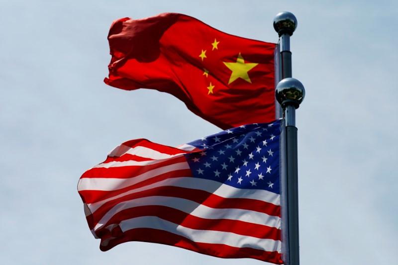 Chinese and US flags flutter