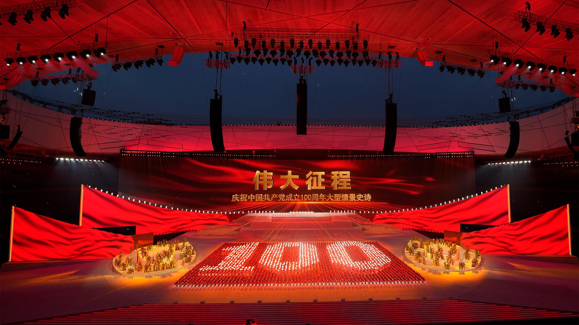Performers form a yellow number 100 at a gala show full of red ahead of the 100th anniversary of the founding of the Chinese Communist Party in Beijing