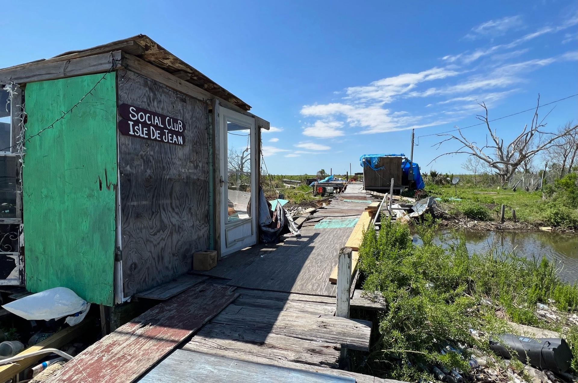 French-speaking Isle de Jean Charles, Louisiana, has abandoned dwellings are everywhere due to storms, erosion, and rising sea-levels.