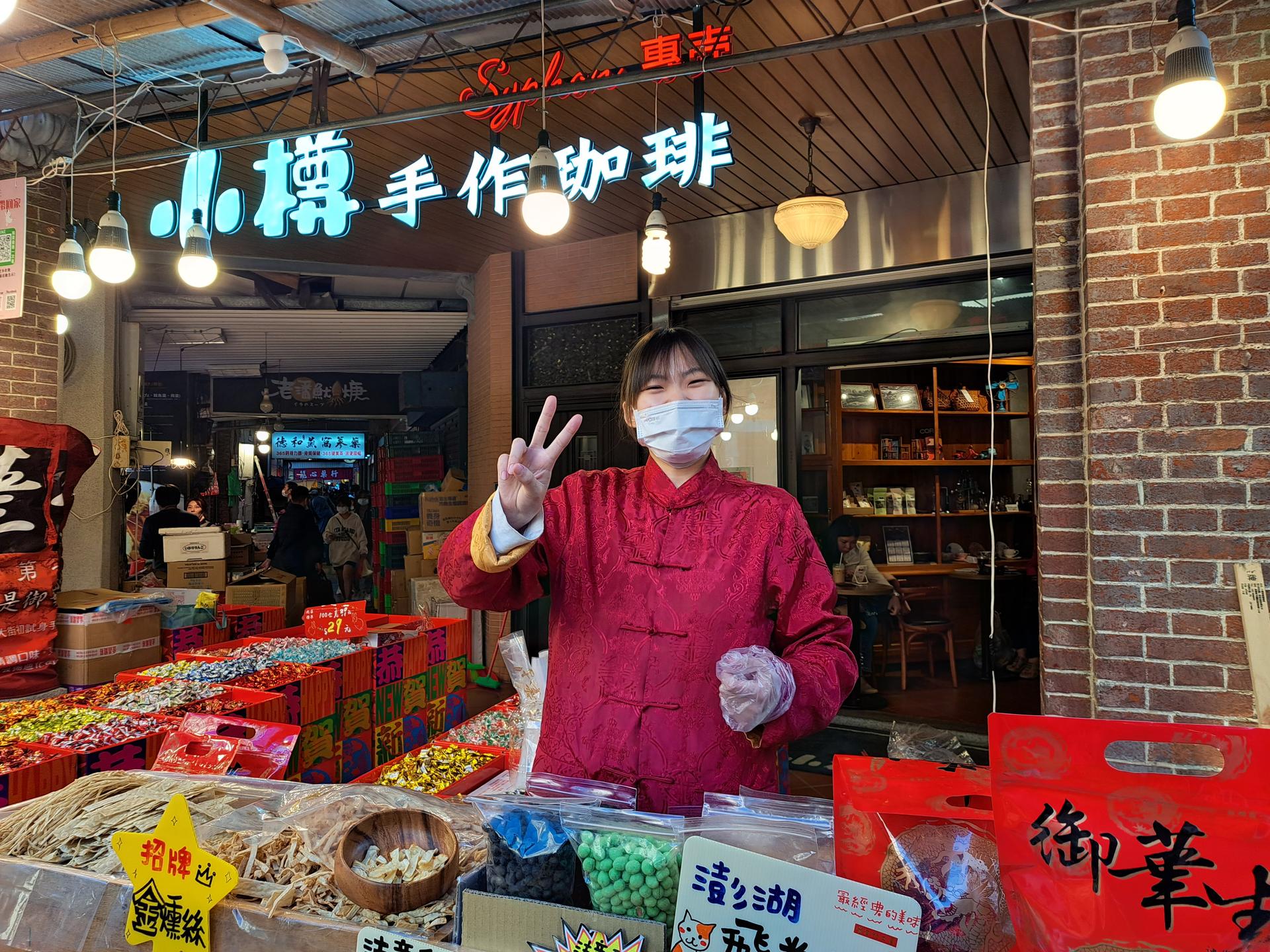 Lin Yu-San sells traditional snacks on Dihua Street. She says more people are visiting the street this year thanks to fewer concerns about COVID-19.