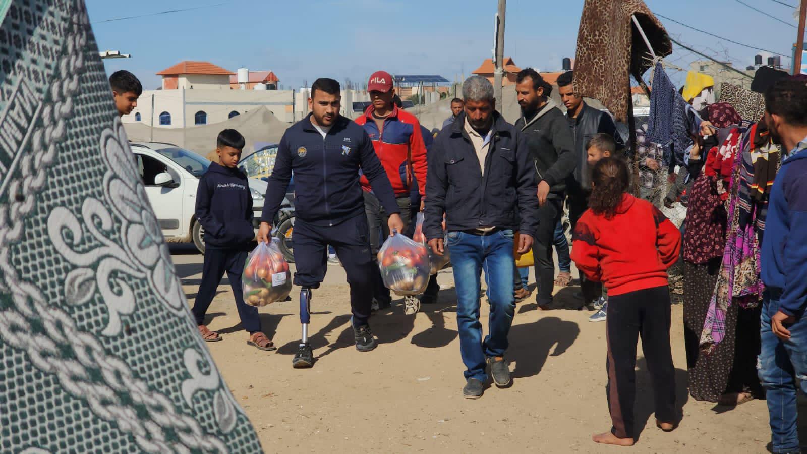 Gaza Sunbird team members distribute much-needed food aid and other supplies in Rafah, Gaza in February 2024.