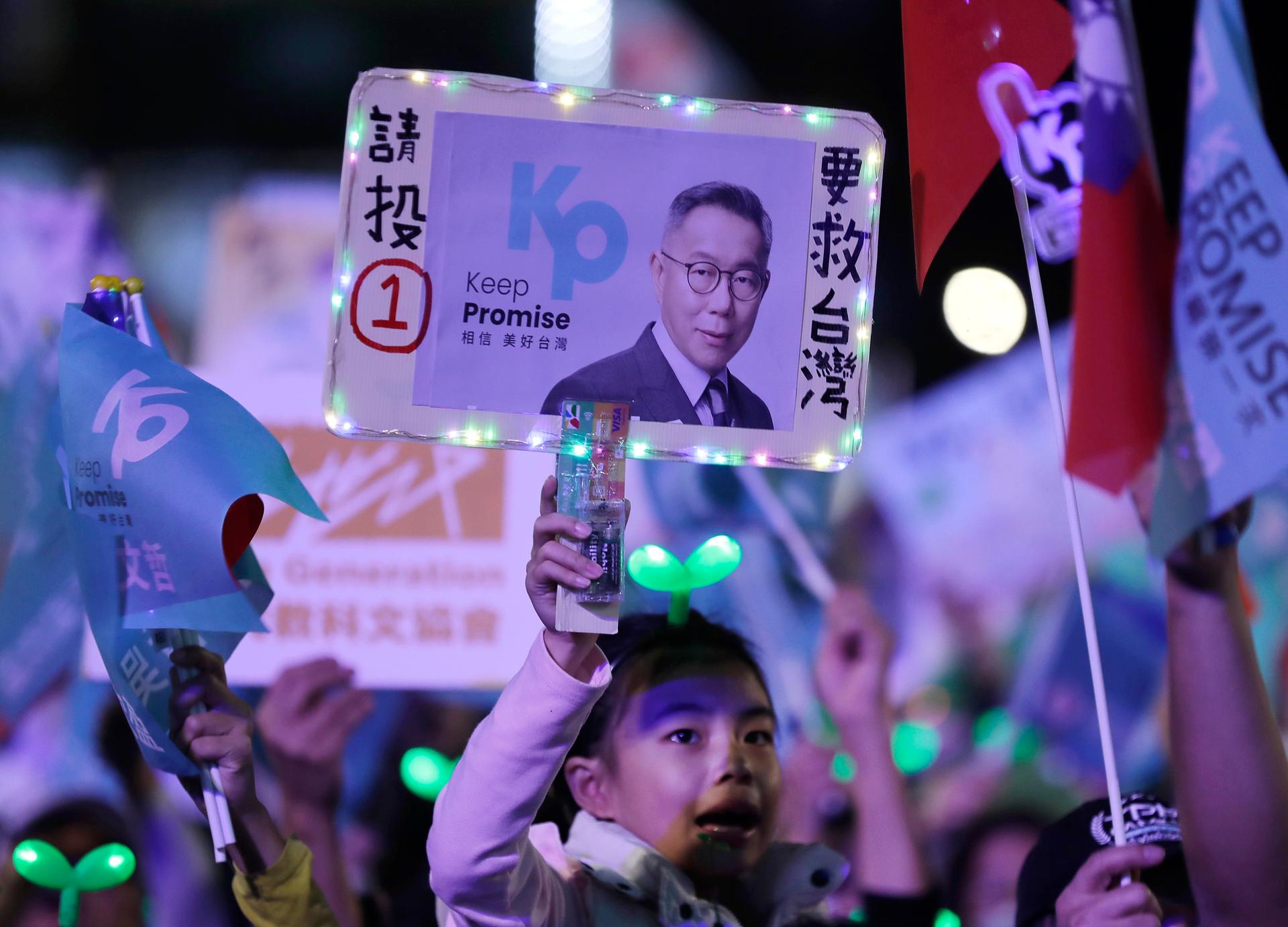 Supporters of Taiwan's Taiwan People's Party (TPP) presidential candidate Ko Wen-je cheer during an election campaign in Taipei, Taiwan, Friday, Jan. 12, 2024. Taiwan will hold its presidential election on Jan. 13, 2024.