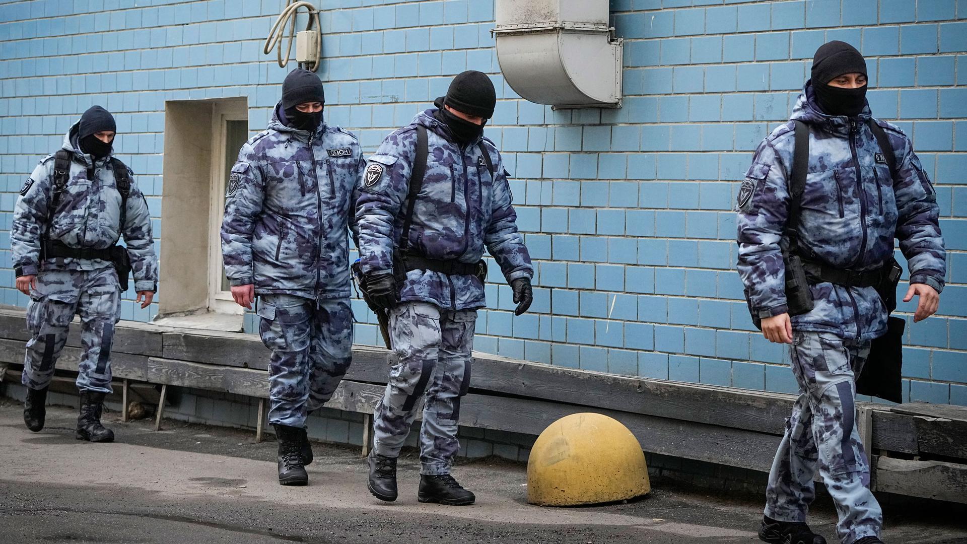 Police officers walk near the Basmanny District Court in Moscow, Russia, Sunday, March 24, 2024. 
