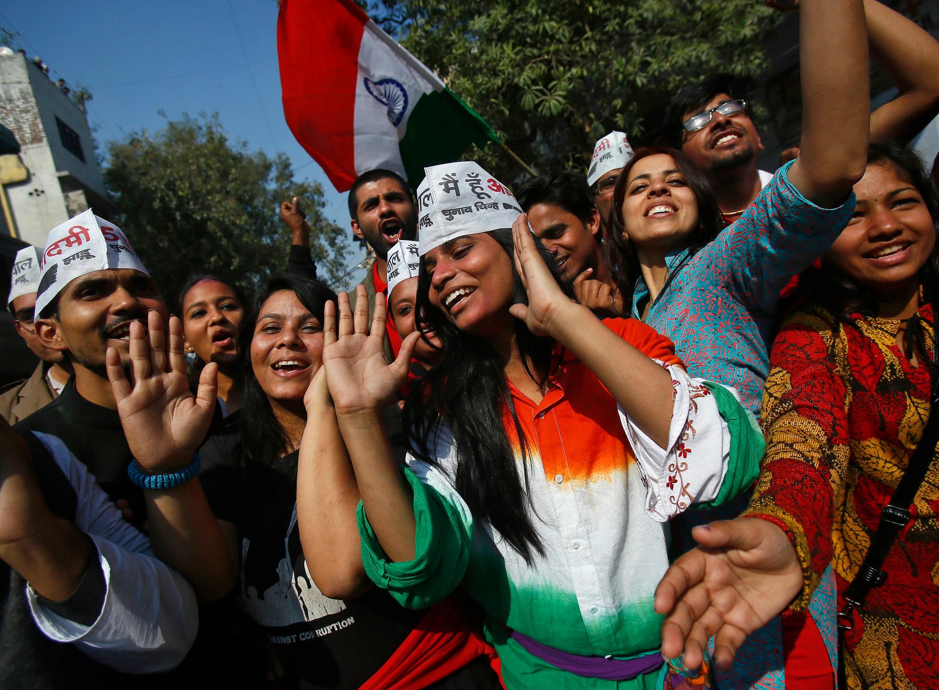 Supporters of Aam Aadmi (Common Man) Party (AAP) take part in the celebrations outside the AAP office in New Delhi February 10, 2015.