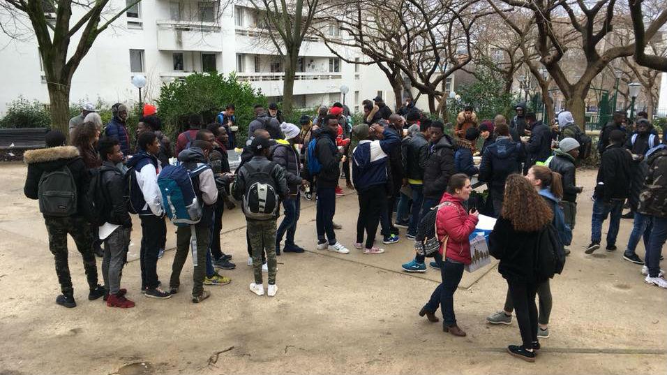 Homeless migrant teenagers meet twice a week in this public park in northern Paris for a hot meal brought by volunteers.