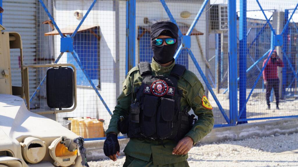 A guard at al-Hol camp at the entrance.
