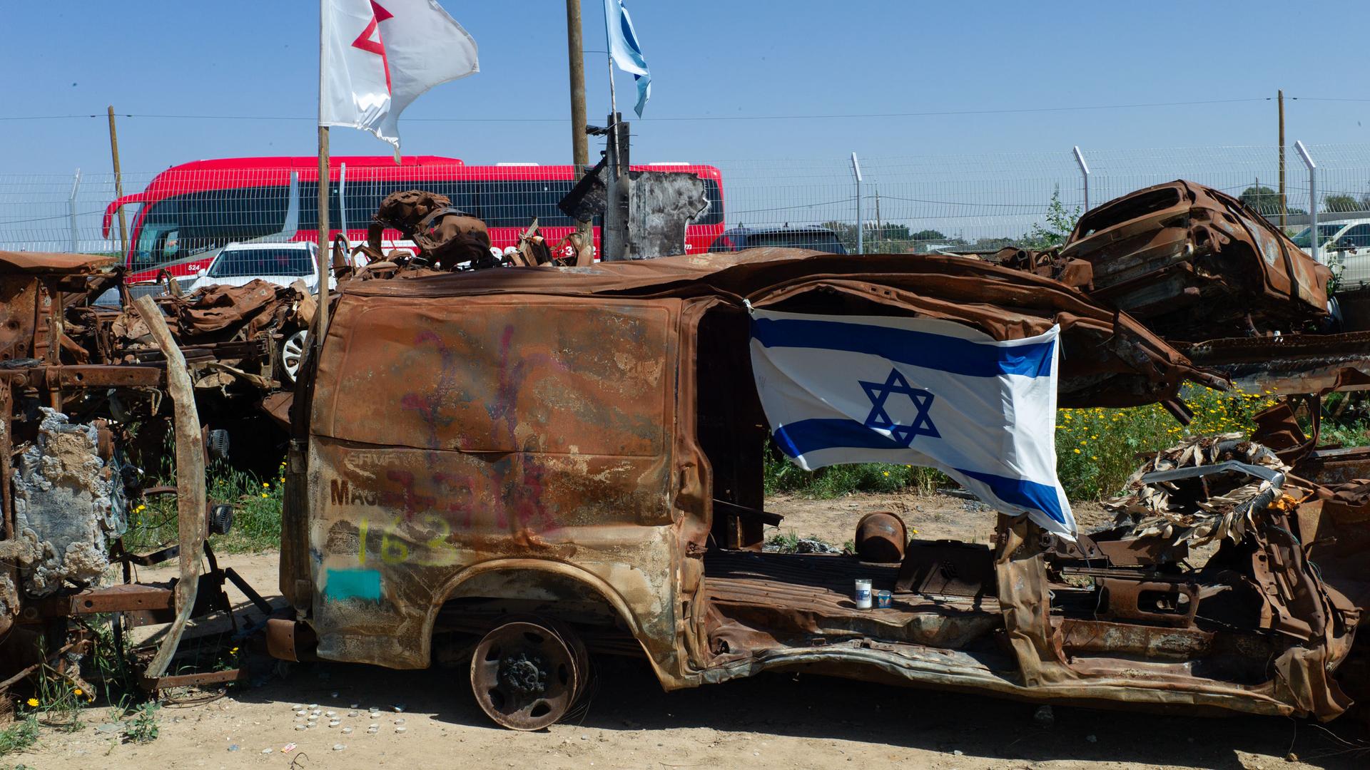 In the Israeli town of Tkuma, about 3 miles from the Gaza strip, vehicles in various states of destruction sit in a giant lot.