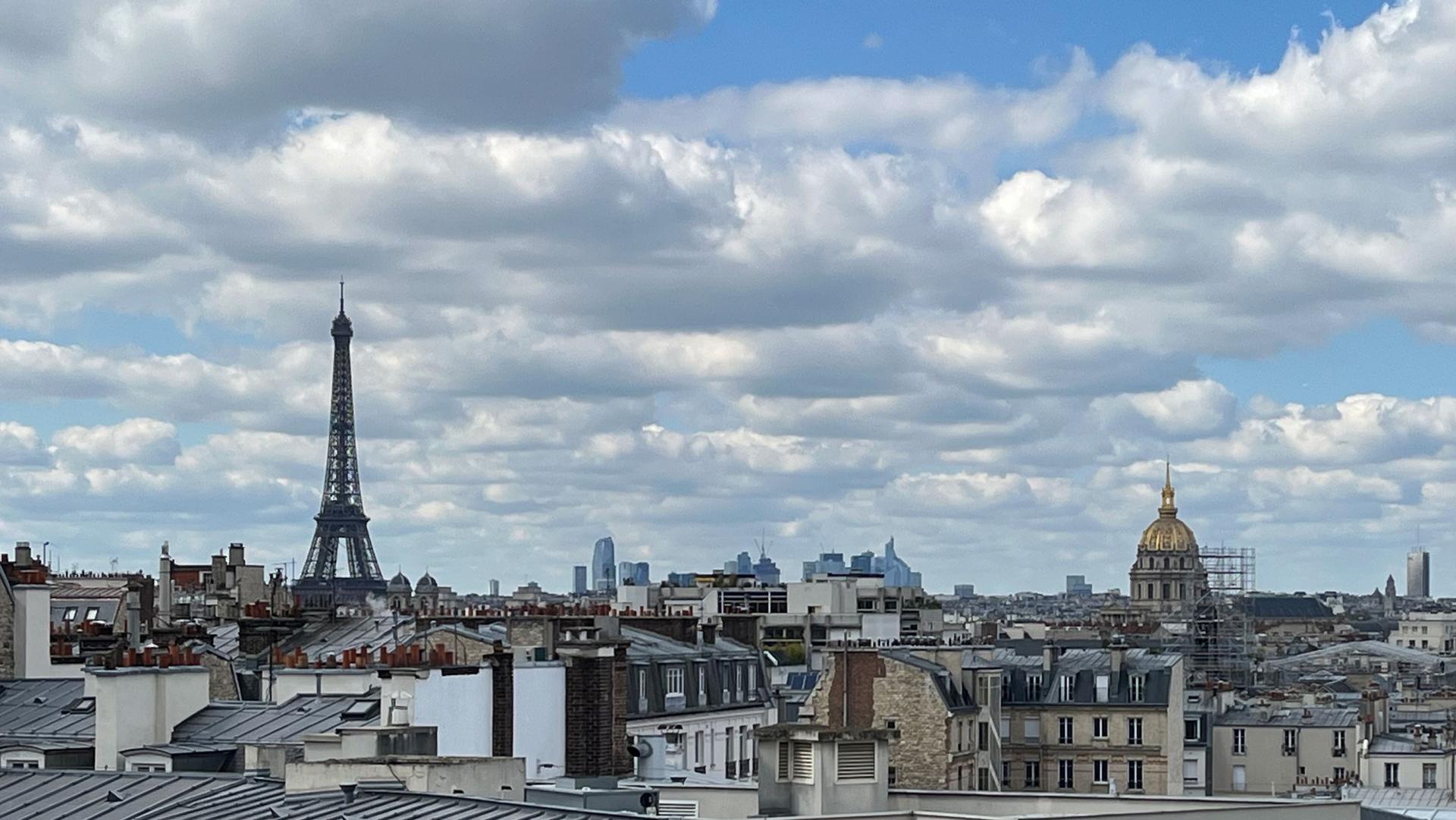A view of Paris, France, with the iconic Eiffel Tower in the distance.