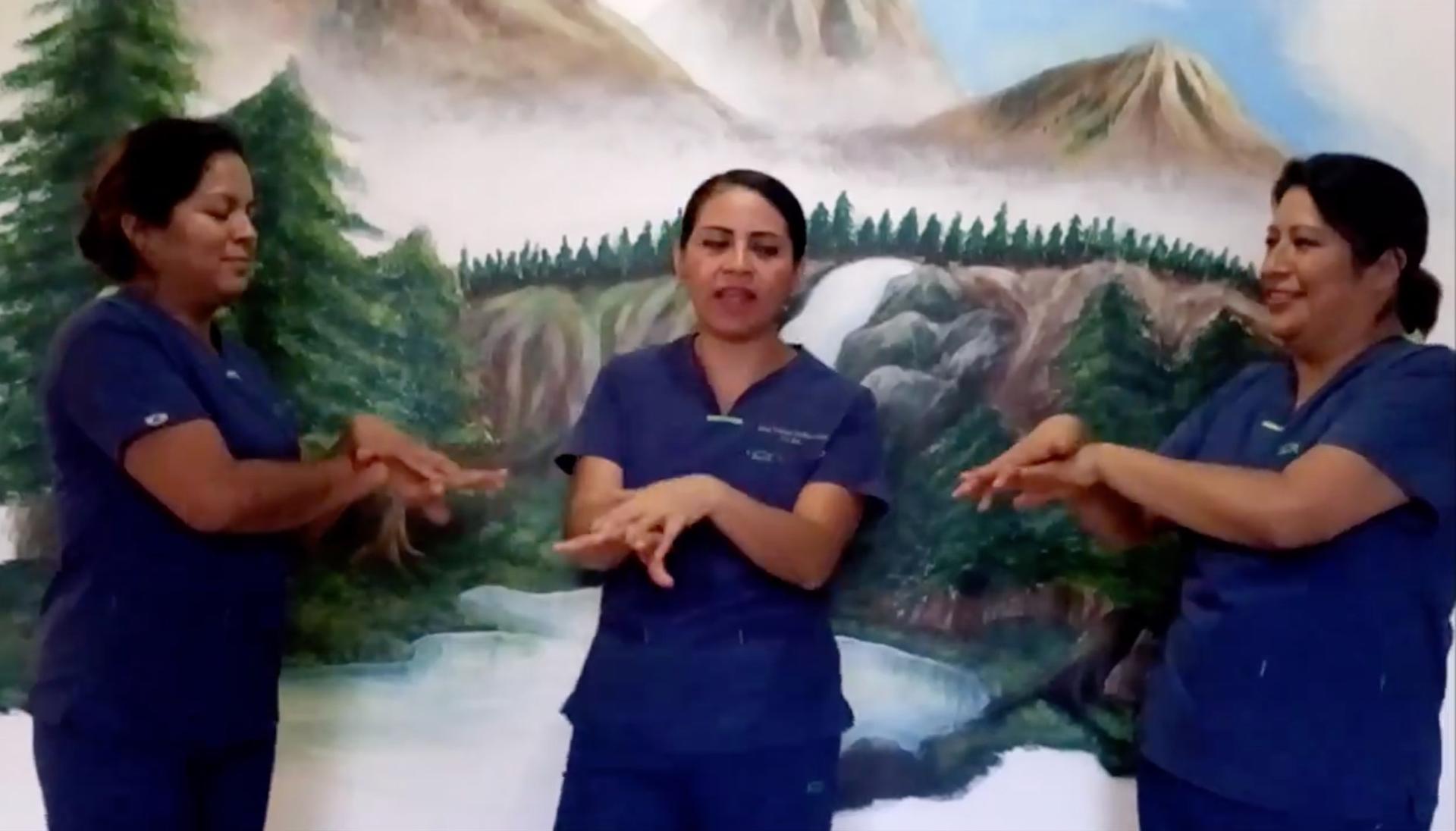 Three nurses in Oaxaca, Mexico, dance and sing a song about washing one's hands.