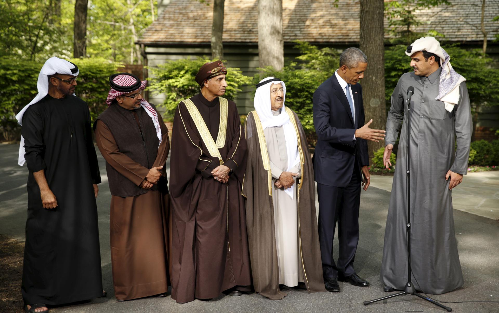 President Barack Obama shakes hands with the Emir of Qatar, Sheikh Tameem bin Hamad Al Thani, while hosting the six-nation Gulf Cooperation Council at Camp David on May 14, 2015.