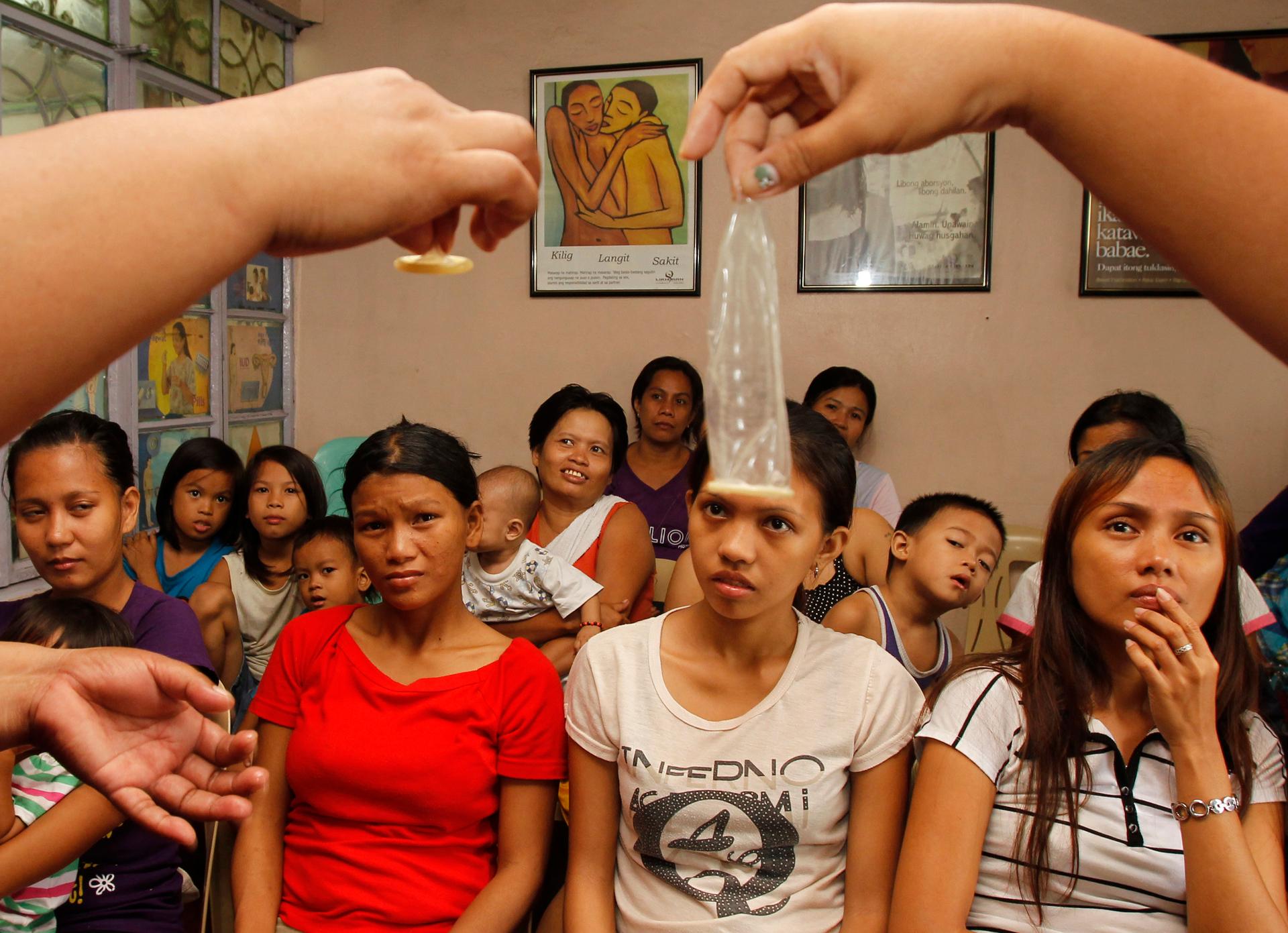 Women receive training in contraception in Manila