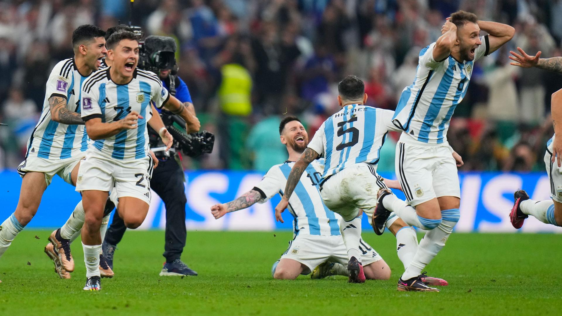 Argentinian players celebrate after winning penalty shootout during the World Cup final soccer match between Argentina and France at the Lusail Stadium in Lusail, Qatar, Sunday, Dec. 18, 2022. 