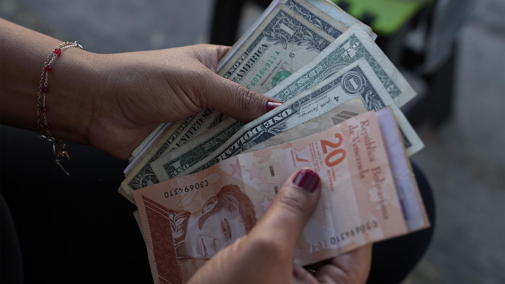 US dollars are now commonly used by businesses in Venezuela. The informal adoption of the dollar has helped to decrease inflation and product shortages.