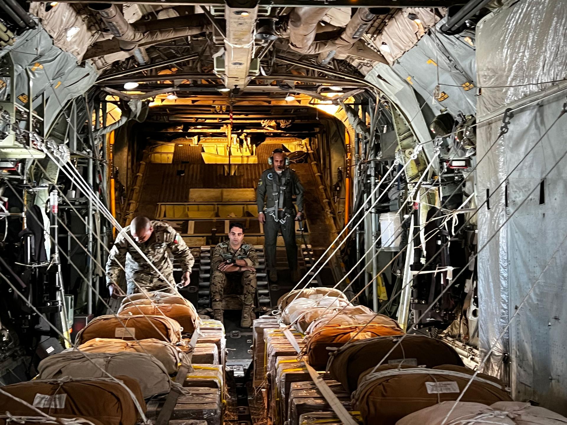 Members of the Royal Jordanian Air Force prepare for aid drop over Gaza.