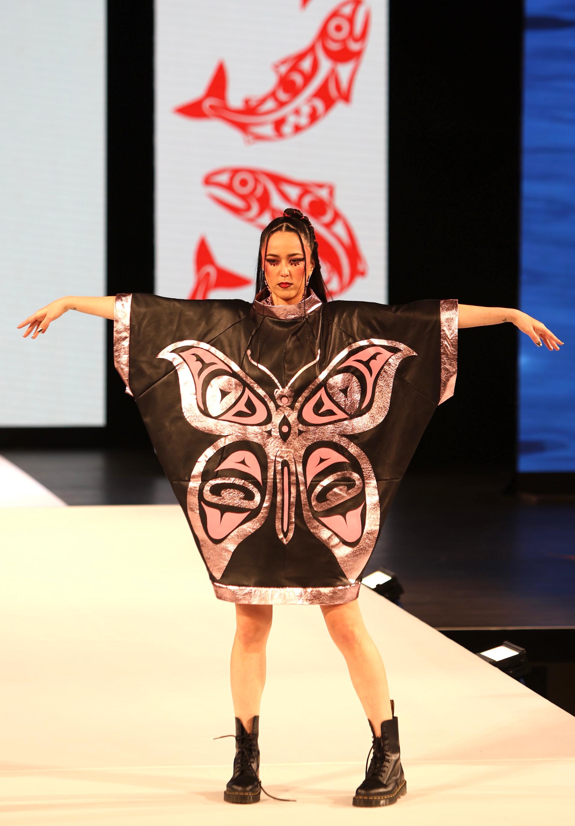 Joleen Mitton wears a butterfly dress designed by Yolonda Skelton.